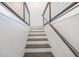Modern staircase with sleek railing and hardwood steps leading to upper levels at 1145 Kirkwood Se Ave # 14, Atlanta, GA 30316