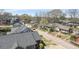 An aerial view of a neighborhood street with houses of varying designs and mature trees lining the streets at 1145 Kirkwood Se Ave # 14, Atlanta, GA 30316