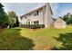 Expansive backyard with mature trees, storage shed and well-manicured shrubs at 2995 Belshire Trl, Dacula, GA 30019
