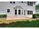 This home boasts a backyard patio perfect for entertaining, complete with ample space and a door leading inside at 2995 Belshire Trl, Dacula, GA 30019