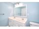 Bright bathroom featuring a double sink vanity with ample counter space and modern lighting at 2995 Belshire Trl, Dacula, GA 30019
