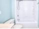 Bathroom with a blue accent wall and a shower/tub combo at 2995 Belshire Trl, Dacula, GA 30019