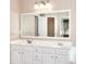 Bathroom with double vanity, a large mirror and white cabinets at 2995 Belshire Trl, Dacula, GA 30019