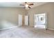 Large bedroom with natural light and double doors leading to the bathroom at 2995 Belshire Trl, Dacula, GA 30019