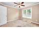 Inviting bedroom with a large window and a ceiling fan for added comfort at 2995 Belshire Trl, Dacula, GA 30019