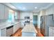 Well-lit kitchen featuring stainless steel appliances, granite counters, and white cabinetry at 2995 Belshire Trl, Dacula, GA 30019