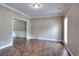 Inviting living room boasts hardwood floors, crown molding, and plenty of natural light at 2995 Belshire Trl, Dacula, GA 30019