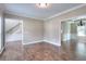 Cozy living room features hardwood floors and easy access to other rooms in the house at 2995 Belshire Trl, Dacula, GA 30019