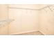 Walk-in closet featuring wire shelving, carpeting, and electrical outlets at 2995 Belshire Trl, Dacula, GA 30019