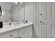 Bright bathroom with white vanity, faucet, and a large mirror at 415 Winn Park Ct, Roswell, GA 30075
