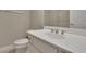 Bathroom with white vanity, faucet, and white tile at 415 Winn Park Ct, Roswell, GA 30075