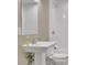Cozy bathroom features a pedestal sink and a shower over tub at 415 Winn Park Ct, Roswell, GA 30075