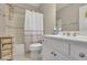 Bathroom featuring a shower, double sink, and storage at 415 Winn Park Ct, Roswell, GA 30075