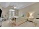 Bright bedroom with a plush bed and a ceiling fan at 415 Winn Park Ct, Roswell, GA 30075