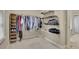 Walk-in closet with custom shelving and ample storage space at 415 Winn Park Ct, Roswell, GA 30075