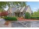 Community clubhouse featuring stone and siding, parking, and mature landscaping at 415 Winn Park Ct, Roswell, GA 30075