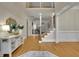 Inviting foyer with hardwood floors, a staircase, and elegant decor creating a grand entrance at 415 Winn Park Ct, Roswell, GA 30075