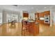 Open concept kitchen area with hardwood floors, kitchen island and breakfast nook at 415 Winn Park Ct, Roswell, GA 30075