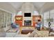 Comfortable living room featuring a fireplace, built-in shelving, and ample seating at 415 Winn Park Ct, Roswell, GA 30075