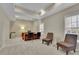 Bright home office with tray ceilings, neutral colors, and two large windows at 415 Winn Park Ct, Roswell, GA 30075