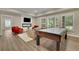 Inviting recreation room with plenty of space, a fireplace, and lots of natural light at 415 Winn Park Ct, Roswell, GA 30075