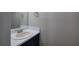 Powder room featuring a sink and a mirror at 4975 Rockstone Way, Acworth, GA 30101