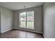 This bedroom features luxury flooring and a large window at 4975 Rockstone Way, Acworth, GA 30101
