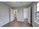 Bedroom with new flooring and two doorways at 4975 Rockstone Way, Acworth, GA 30101