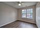 This bedroom has beautiful wood flooring and a ceiling fan at 4975 Rockstone Way, Acworth, GA 30101