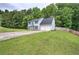 Lovely two-story home with an attached two-car garage, landscaped yard, and long driveway at 4975 Rockstone Way, Acworth, GA 30101