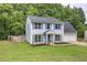 Charming home with light blue siding, bright shutters, and a well-maintained lawn with mature trees at 4975 Rockstone Way, Acworth, GA 30101