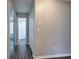 Hallway leads to a bathroom, closet, and other rooms, with wood-look flooring at 4975 Rockstone Way, Acworth, GA 30101