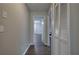 Hallway features wood-look floors and access to various rooms in the home at 4975 Rockstone Way, Acworth, GA 30101