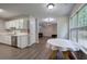 Open-concept kitchen seamlessly connects to the living area, perfect for entertaining at 4975 Rockstone Way, Acworth, GA 30101