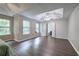 Spacious main bedroom featuring tray ceilings, ceiling fan, and new hard surface flooring at 4975 Rockstone Way, Acworth, GA 30101