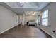 A main bedroom with modern ceiling fan, tray ceilings, and neutral paint throughout at 4975 Rockstone Way, Acworth, GA 30101