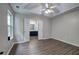 Main bedroom with modern ceiling fan, neutral paint and hard surface flooring throughout at 4975 Rockstone Way, Acworth, GA 30101