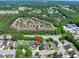 Aerial view of a well-maintained neighborhood surrounded by lush greenery, convenient to shopping at 1186 Hawthorn Ln, Grayson, GA 30017