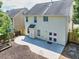 Open backyard with a concrete patio, garden beds, and wood fencing offering privacy at 1186 Hawthorn Ln, Grayson, GA 30017