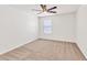 Bright, carpeted bedroom with a ceiling fan and a window that provides natural light at 1186 Hawthorn Ln, Grayson, GA 30017