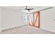 Bedroom with a ceiling fan and closet with a large barn door with wood trim at 1186 Hawthorn Ln, Grayson, GA 30017