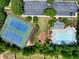 Aerial view of community amenities including pool, tennis courts, and parking at 1186 Hawthorn Ln, Grayson, GA 30017