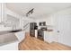 The kitchen features stainless steel appliances, granite countertops, and white cabinetry at 1186 Hawthorn Ln, Grayson, GA 30017