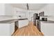 Modern kitchen with stainless steel appliances, granite countertops, and white cabinets at 1186 Hawthorn Ln, Grayson, GA 30017