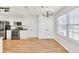 Bright eat-in kitchen features stainless steel appliances, and natural light streaming through a window at 1186 Hawthorn Ln, Grayson, GA 30017