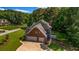 A home nestled in a lush, green neighborhood with mature trees and manicured lawns at 125 Legacy Way, Oxford, GA 30054