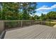 Spacious back deck with wooden railings, perfect for outdoor entertaining at 125 Legacy Way, Oxford, GA 30054