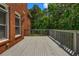 Expansive back deck overlooking a lush yard with mature trees at 125 Legacy Way, Oxford, GA 30054