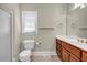 Neutral bathroom featuring a single sink vanity and shower at 125 Legacy Way, Oxford, GA 30054