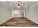 Large, bright bedroom with wood flooring and trey ceiling at 125 Legacy Way, Oxford, GA 30054